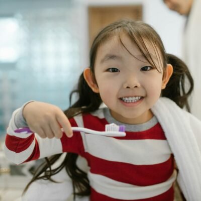 Cheerful Child while Cleaning Teeth